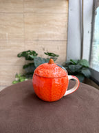 Orange mug with lid